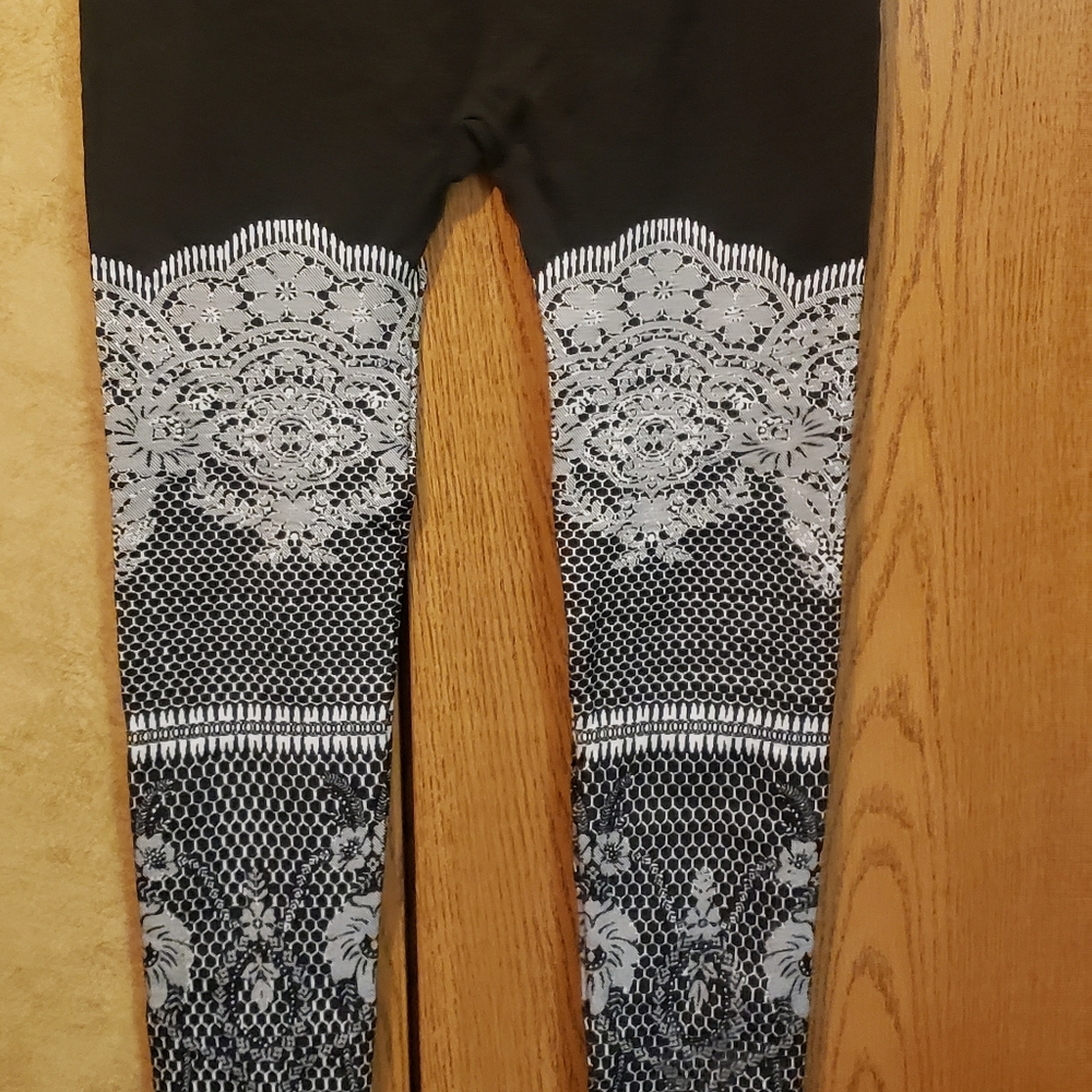 Black leggings with lace looking detail, size med
